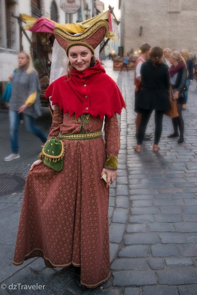 A girl in Old Town Tallinn with a traditional costumes